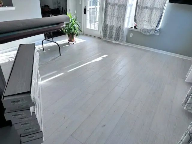 Gray plank flooring installed in a living room