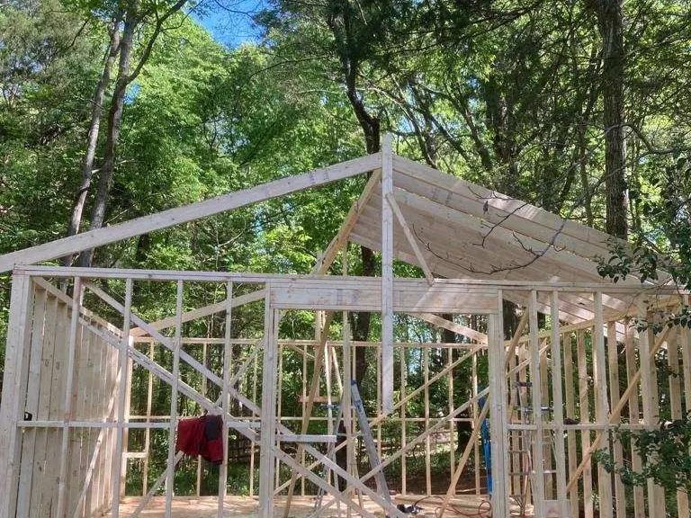 Storage shed framed on a new platform base